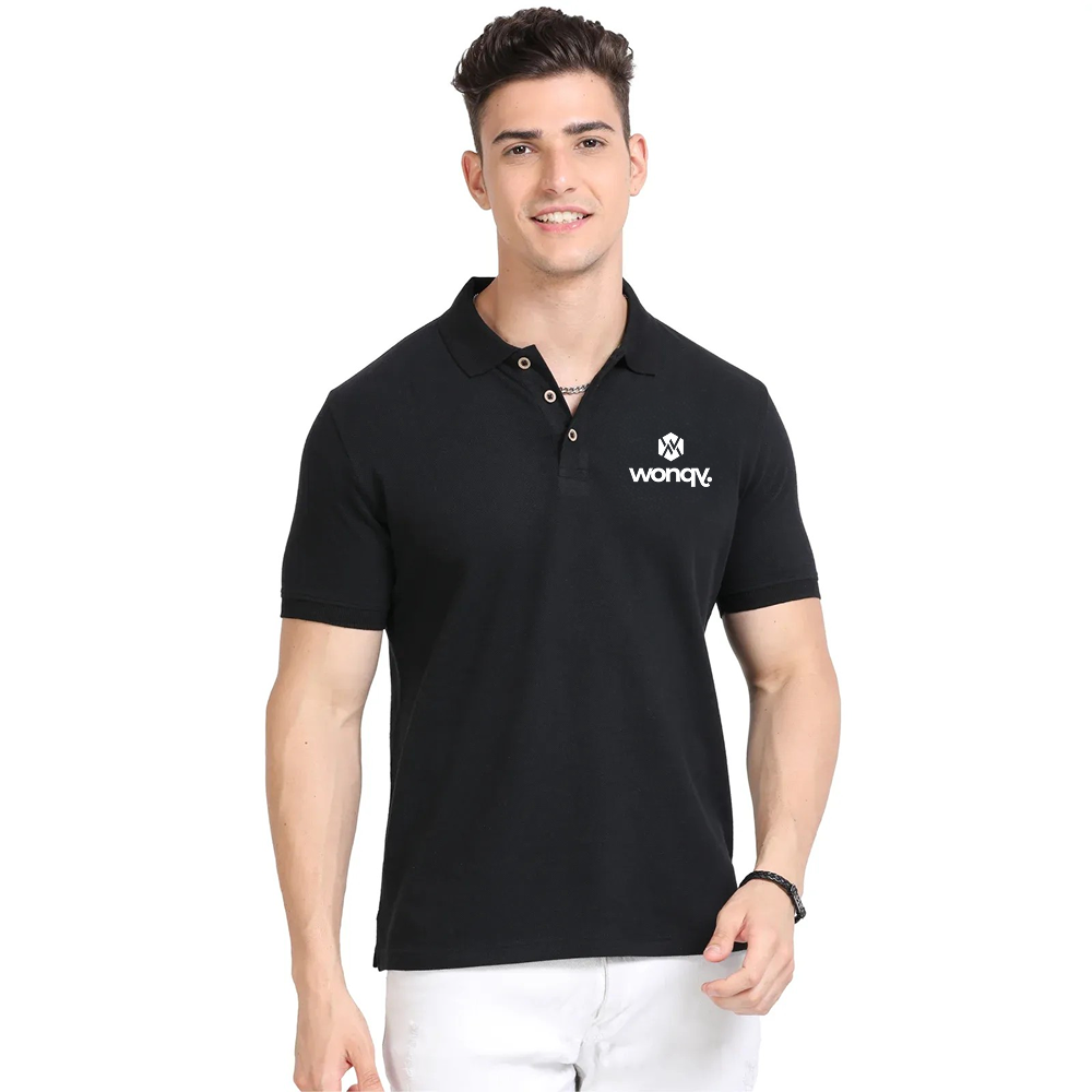 Man wearing a black polo shirt with a logo on a white background