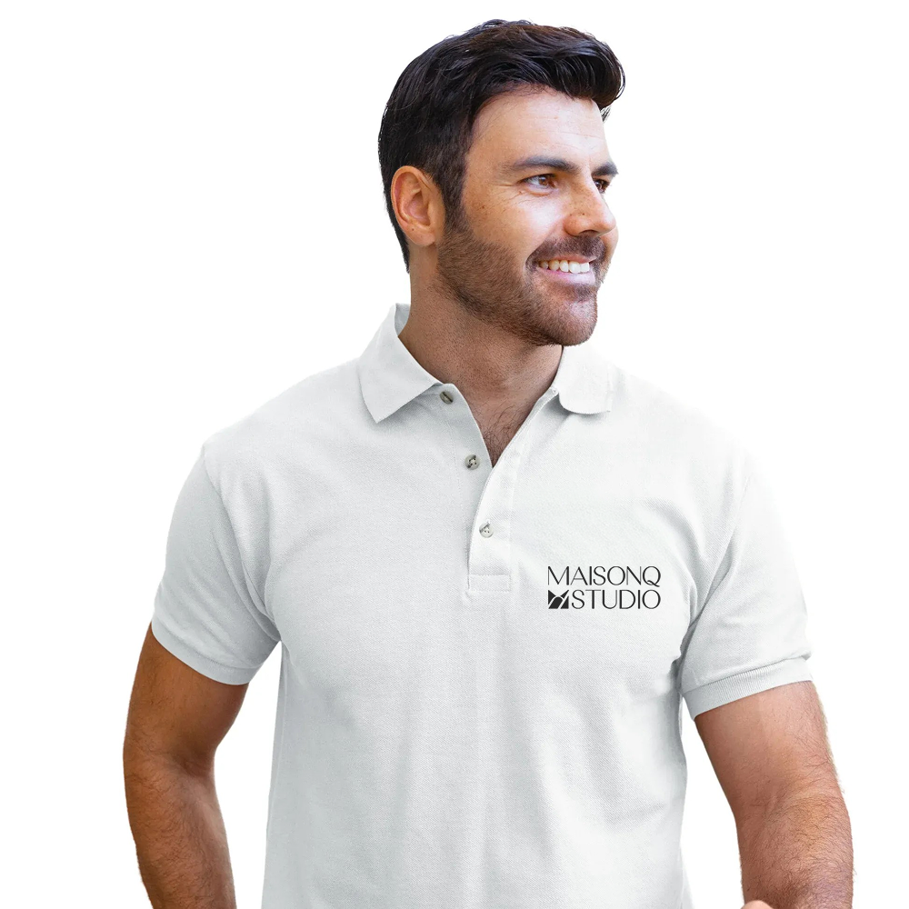 Man wearing a white polo shirt with 'MAISONQ STUDIO' logo on a white background