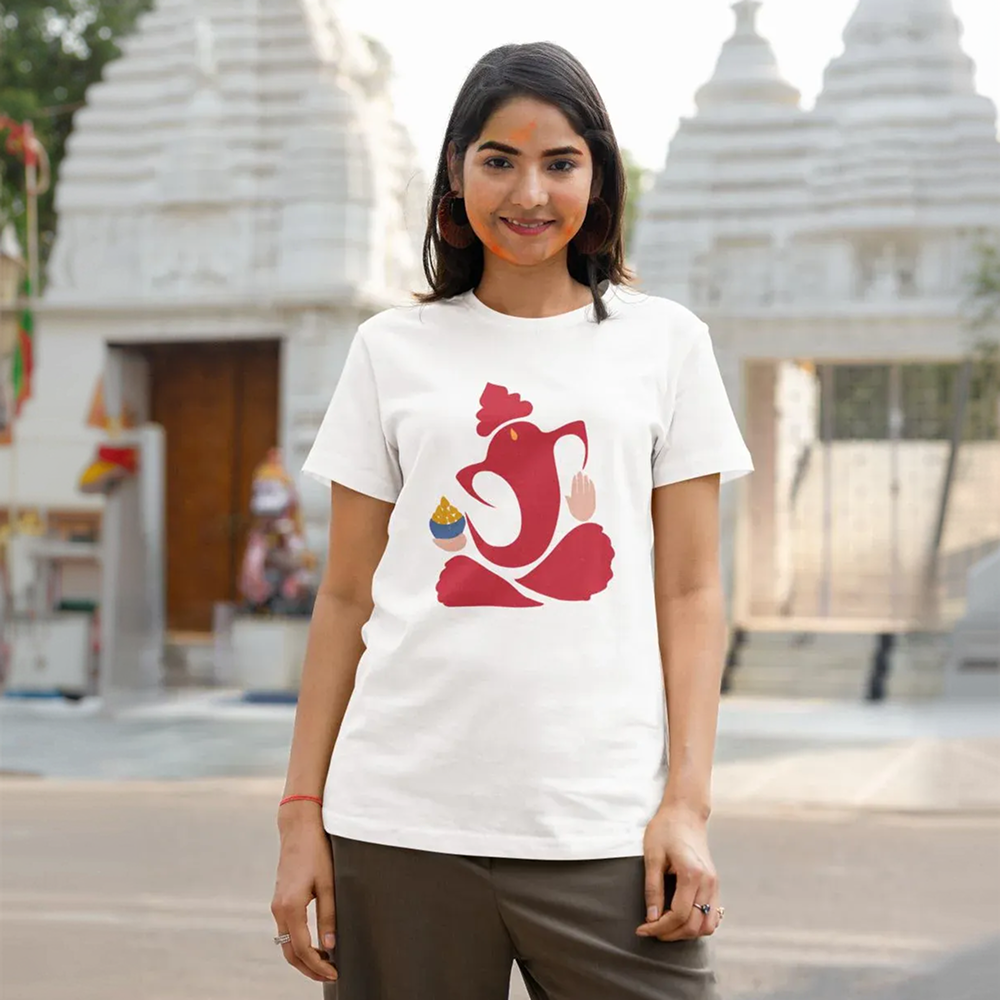 Woman wearing a white t-shirt with a red symbol in front of a temple.
