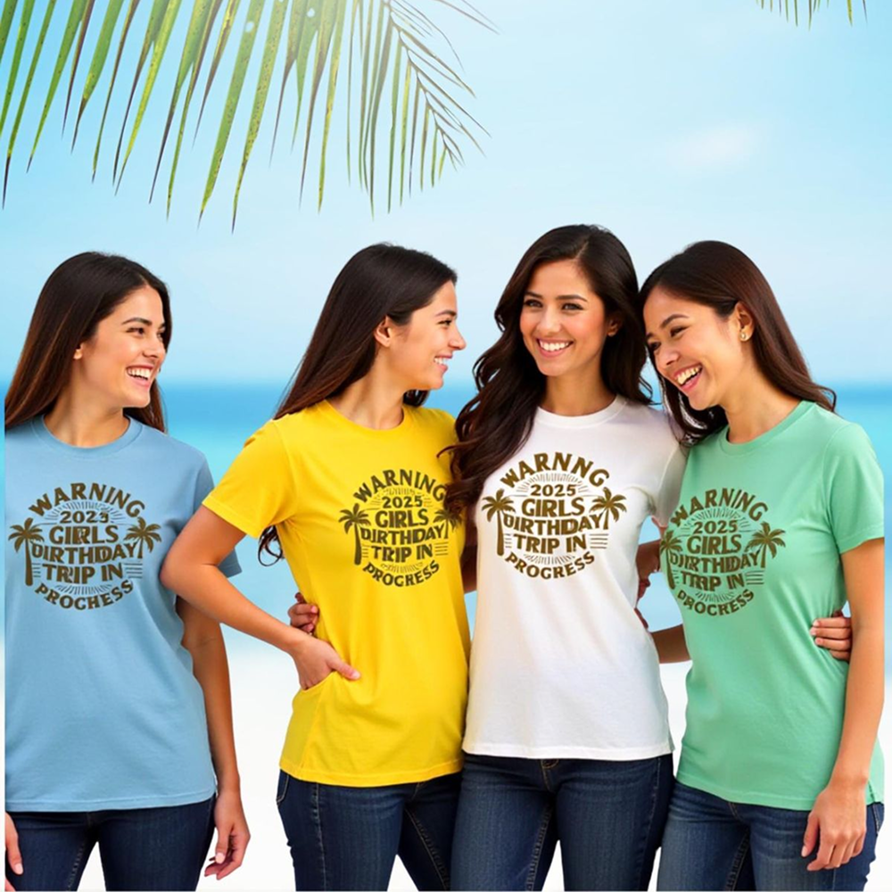Four women wearing matching t-shirts with a beach background