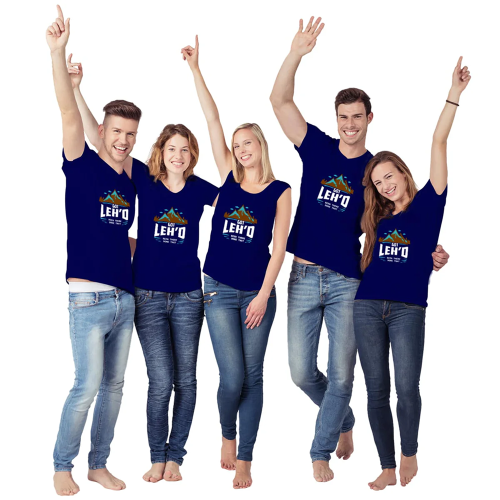 Five people wearing matching blue t-shirts with a logo and text, standing together on a white background.